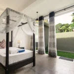 Deluxe Family Room with two four-poster beds at Jasper House Hiriketiya