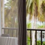 Balcony and palm outlook from the Deluxe Open Air Room