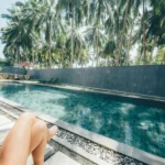 Relaxing by the lap pool with palm trees at Jasper House Hiriketiya